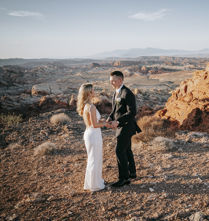 Tie the knot with a Valley of Fire helicopter wedding ceremony featuring breathtaking views, private SUV transfers, wedding officiant, photographer, champagne toast, and scenic flight over Las Vegas